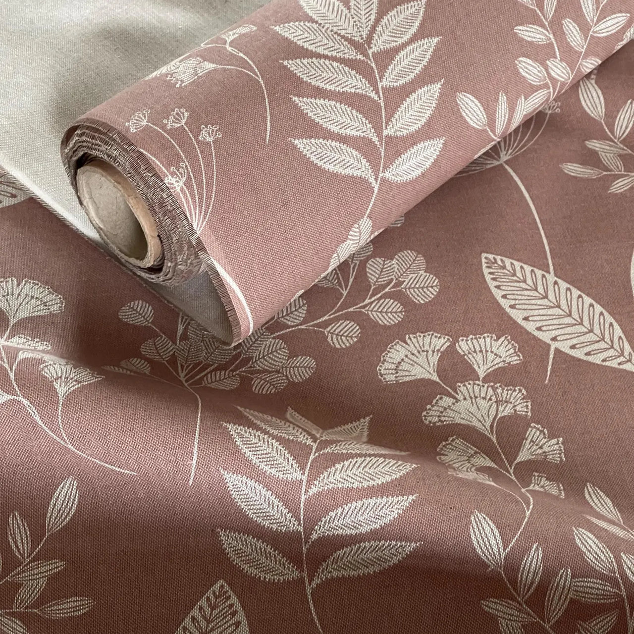 Modern botanical cotton blend fabric in muted pink tones