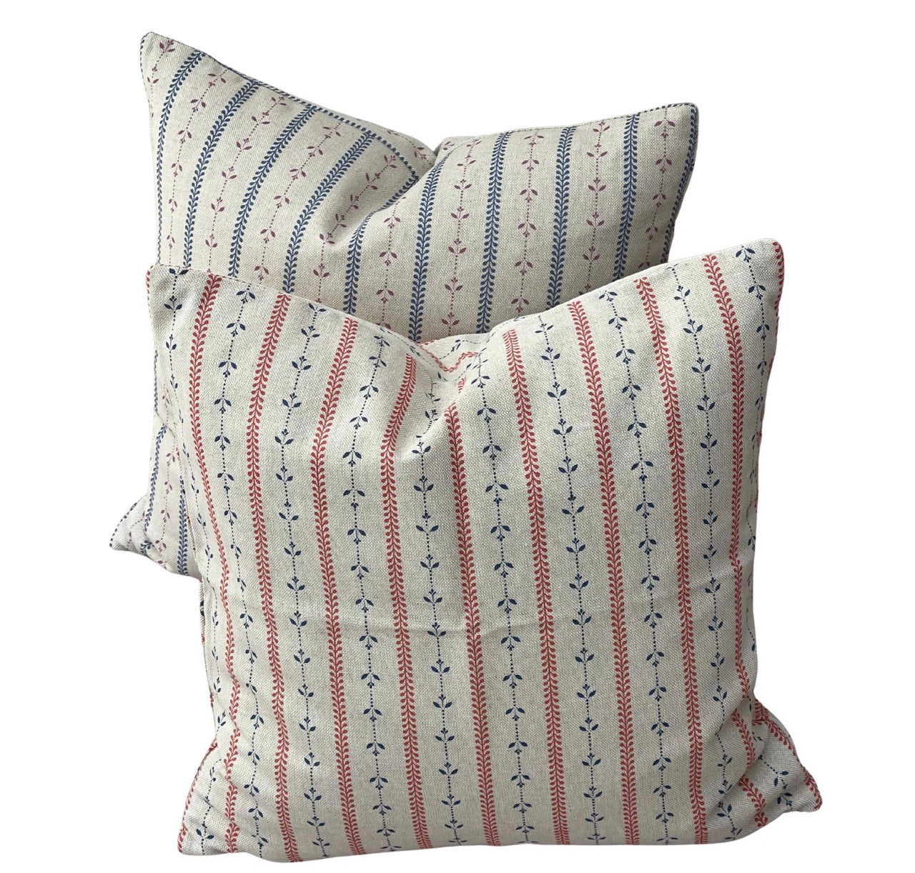 Red and blue botanical stripe cushion covers with delicate leaf motifs