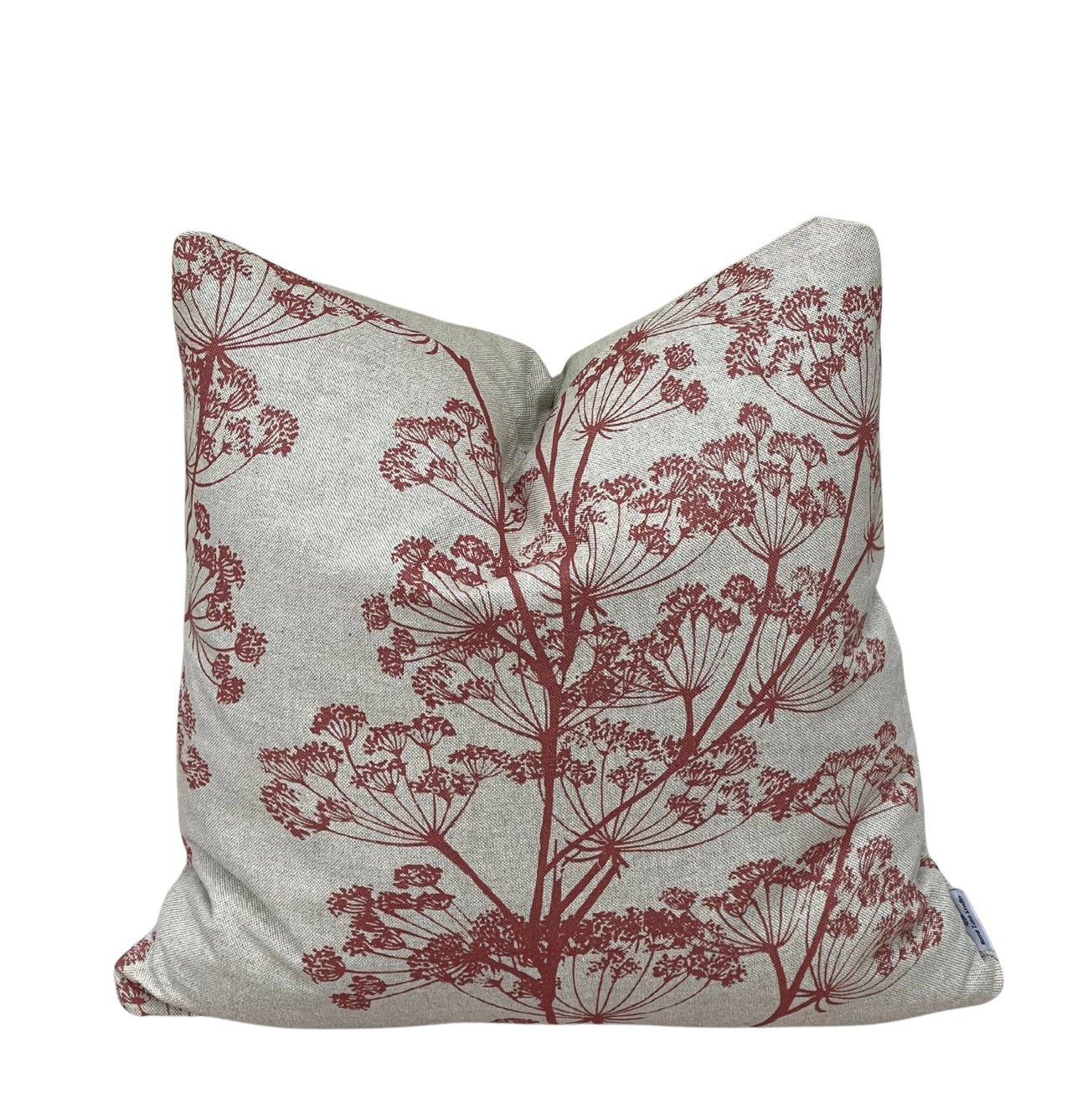 Angled view of a red botanical cow parsley cushion cover handmade in the UK