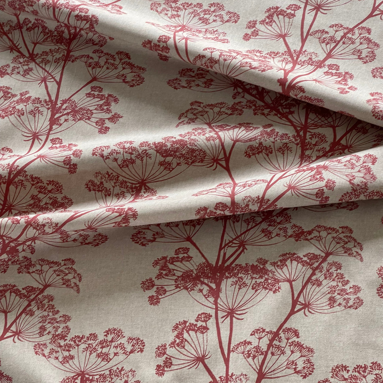Red cow parsley fabric with botanical floral print on natural linen look background