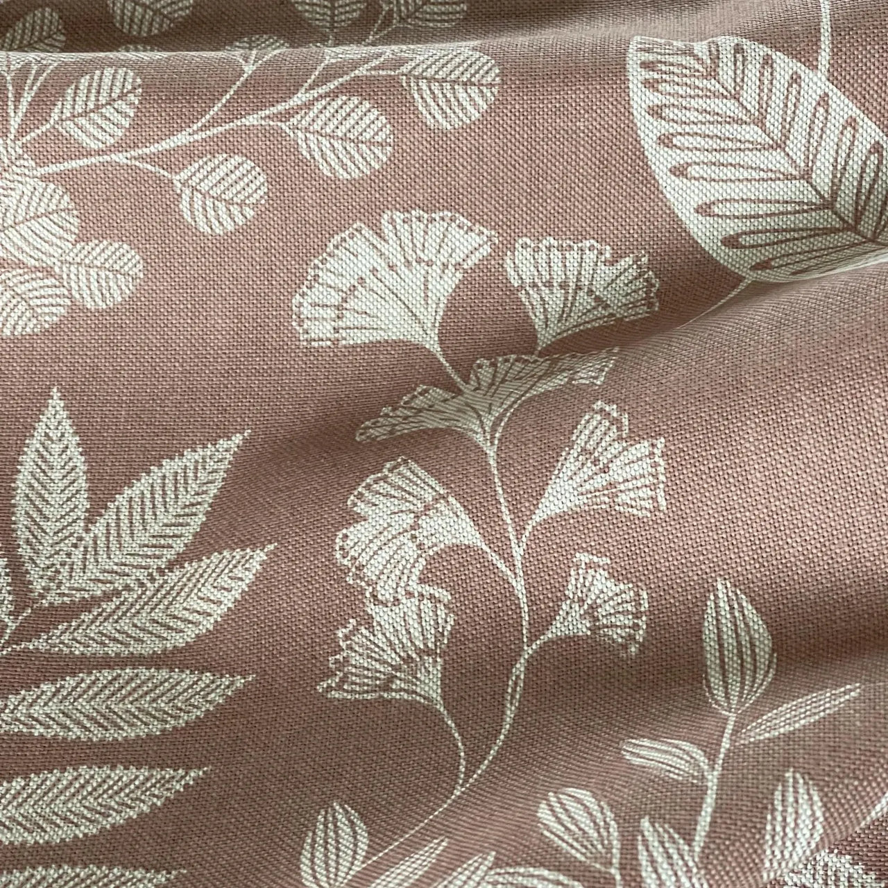 Rose linen effect curtain fabric with detailed plant motifs
