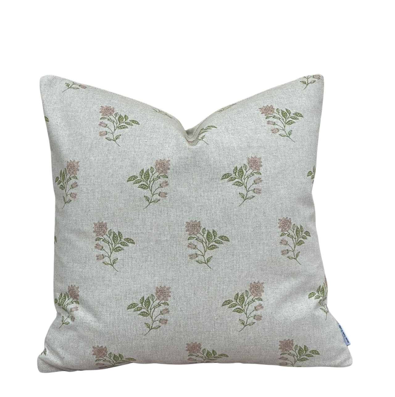 Rose Meadow pink floral cushion cover with delicate sage green leaves and dusty pink flowers on natural linen-look fabric.