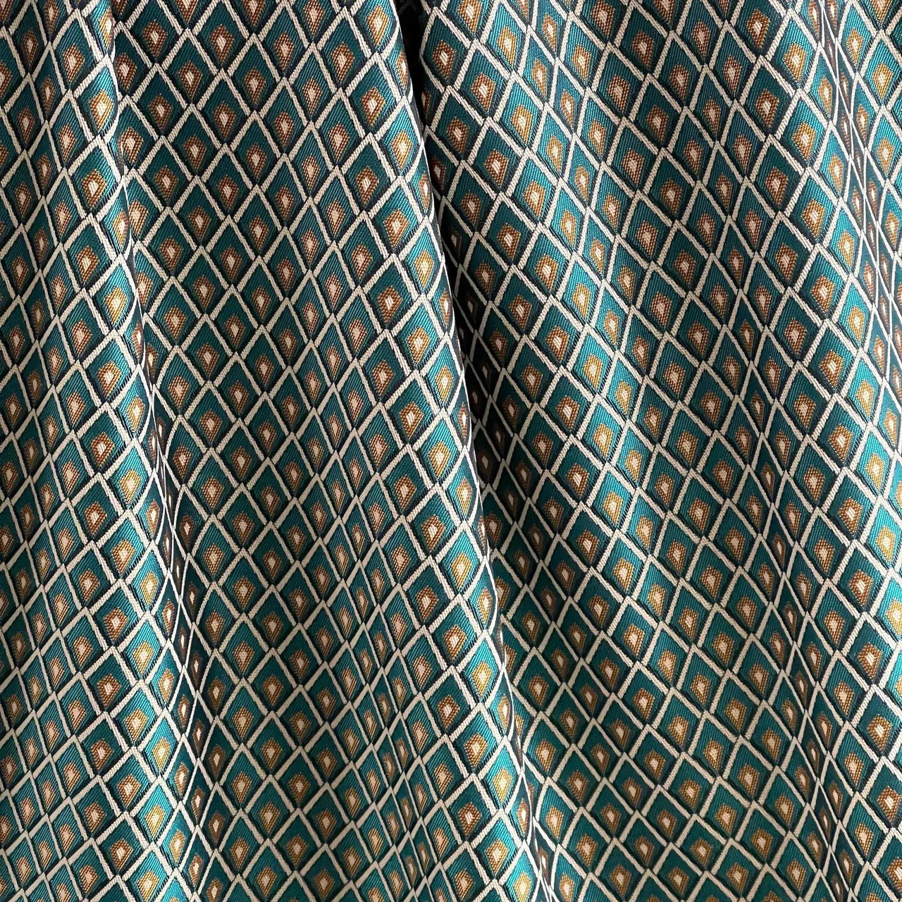 Teal and gold geometric curtain fabric with refined small-scale pattern
