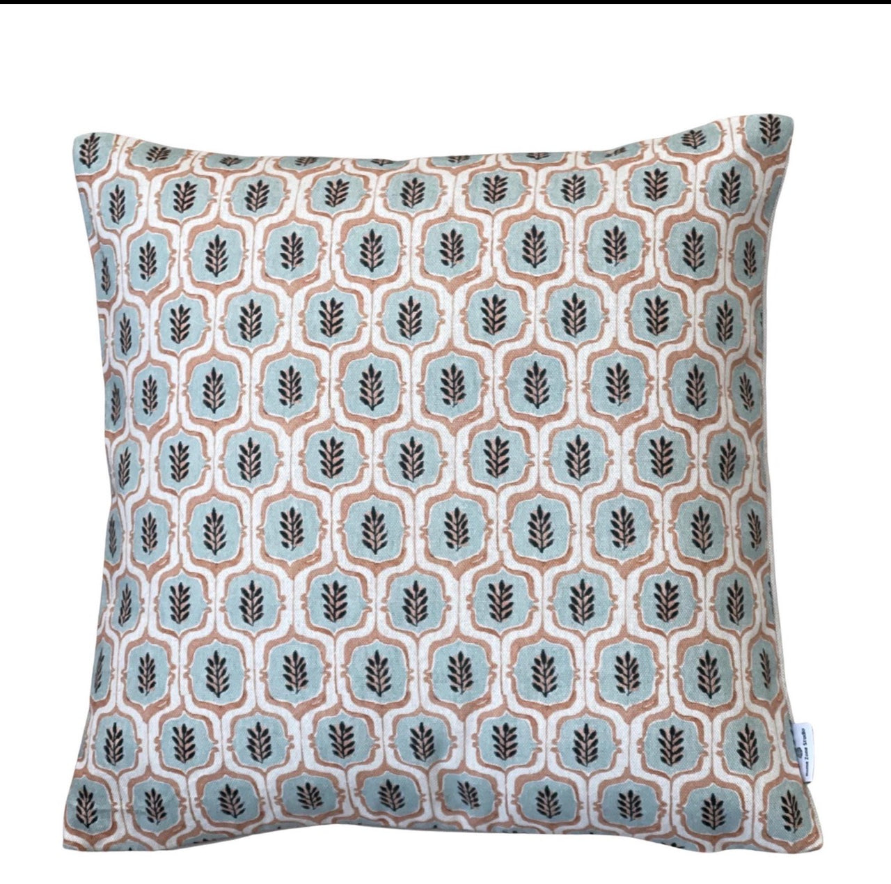 Handmade sage green and rust botanical leaf cushion cover with a geometric trellis pattern