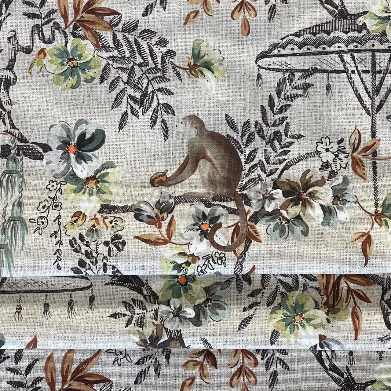 Monkey-themed safari fabric with folded texture and botanical florals — perfect for whimsical curtains, nursery textiles, or creative crafts.