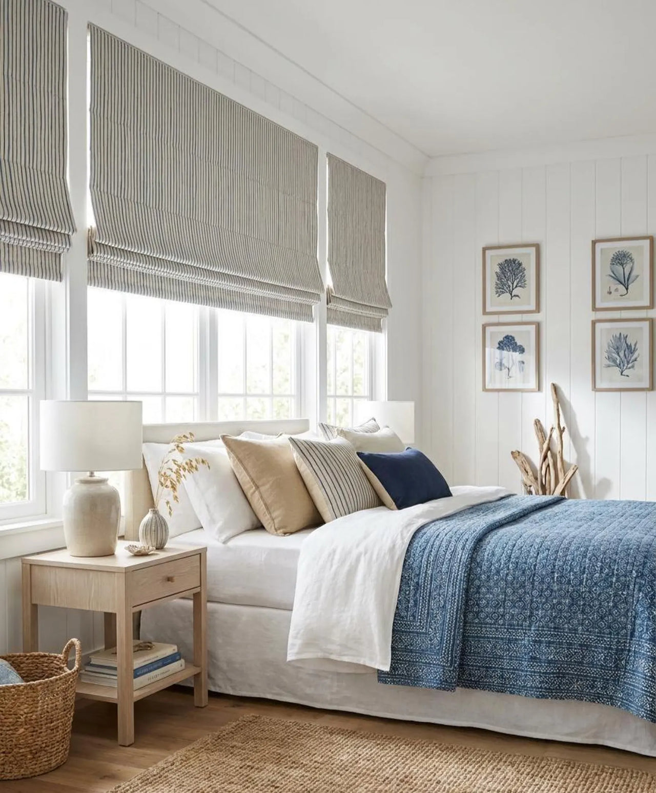 Seabreeze blue and beige striped Roman blinds in a bright coastal-style bedroom
