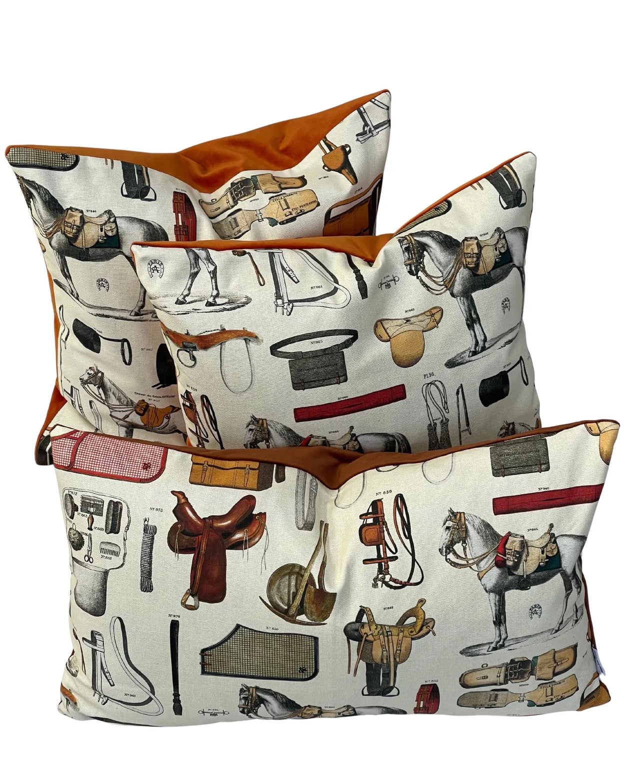 Set of three pillows with equestrian-themed patterns on a white background
