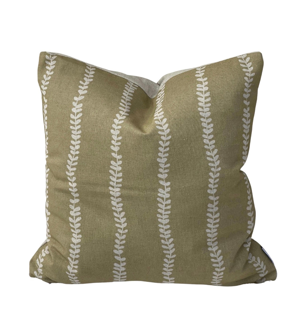 Close-up of soft gold linen-look cushion cover featuring vertical cream botanical leaf stripes