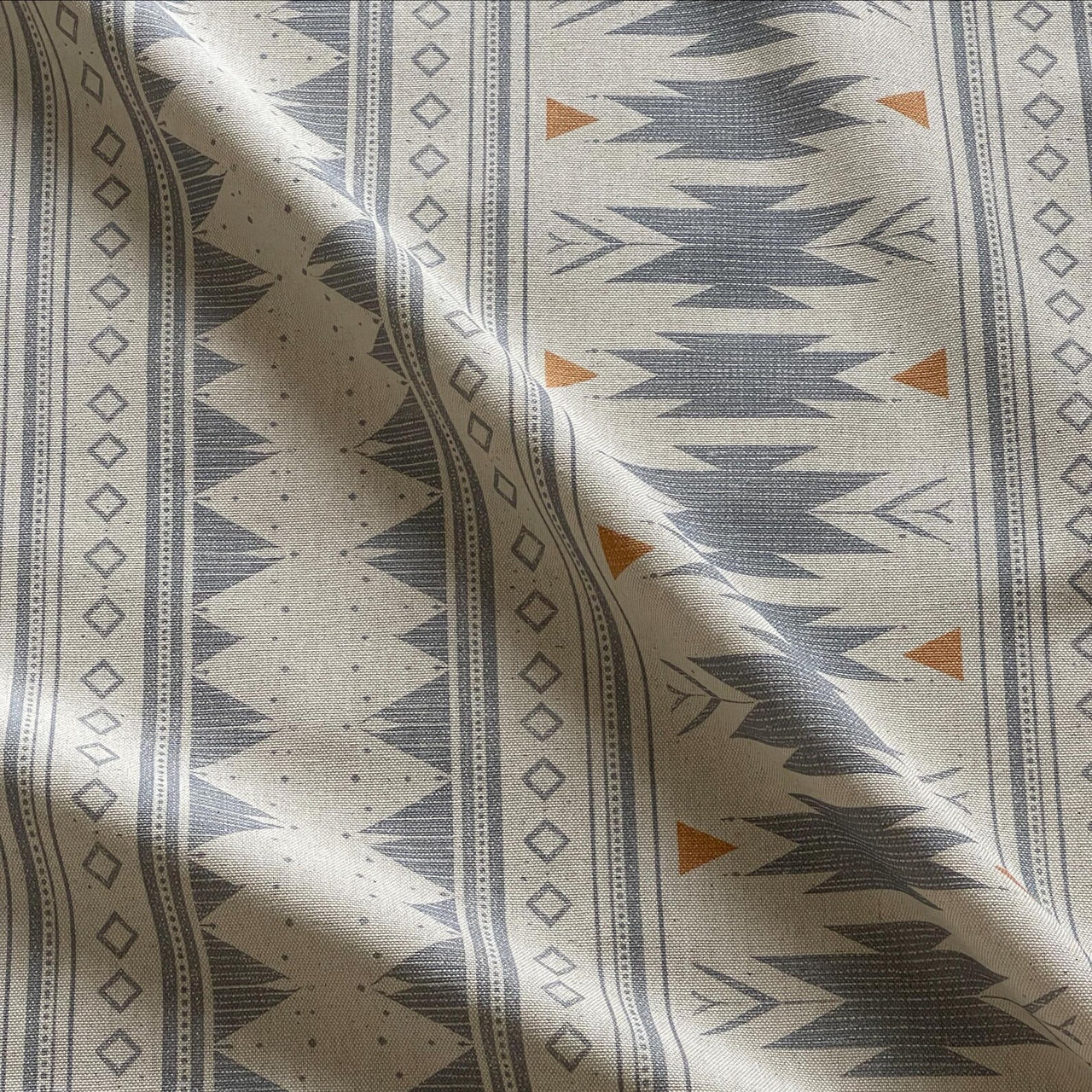 Linen look cotton fabric with blue grey tribal geometric design