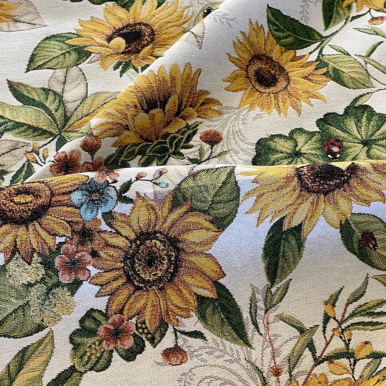 Sunflower and foliage fabric in yellow, green, and natural tones