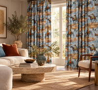 Thumbnail for Stylish neutral living room with floor-length blue surrealist animal print curtains, featuring elephants, camels and horses with elegant contemporary furniture.