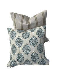 Thumbnail for Handmade cushion cover featuring teal foliage motifs on a neutral textured linen-look fabric.