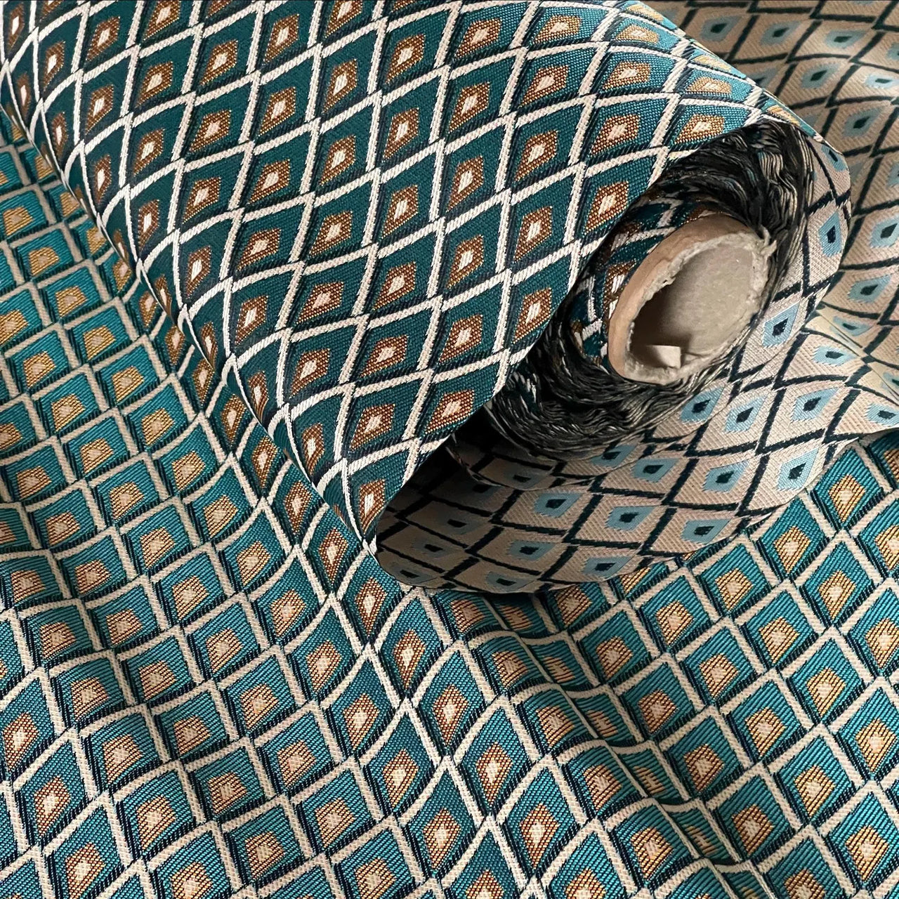 Woven jacquard drapery fabric with classic teal and gold lattice pattern