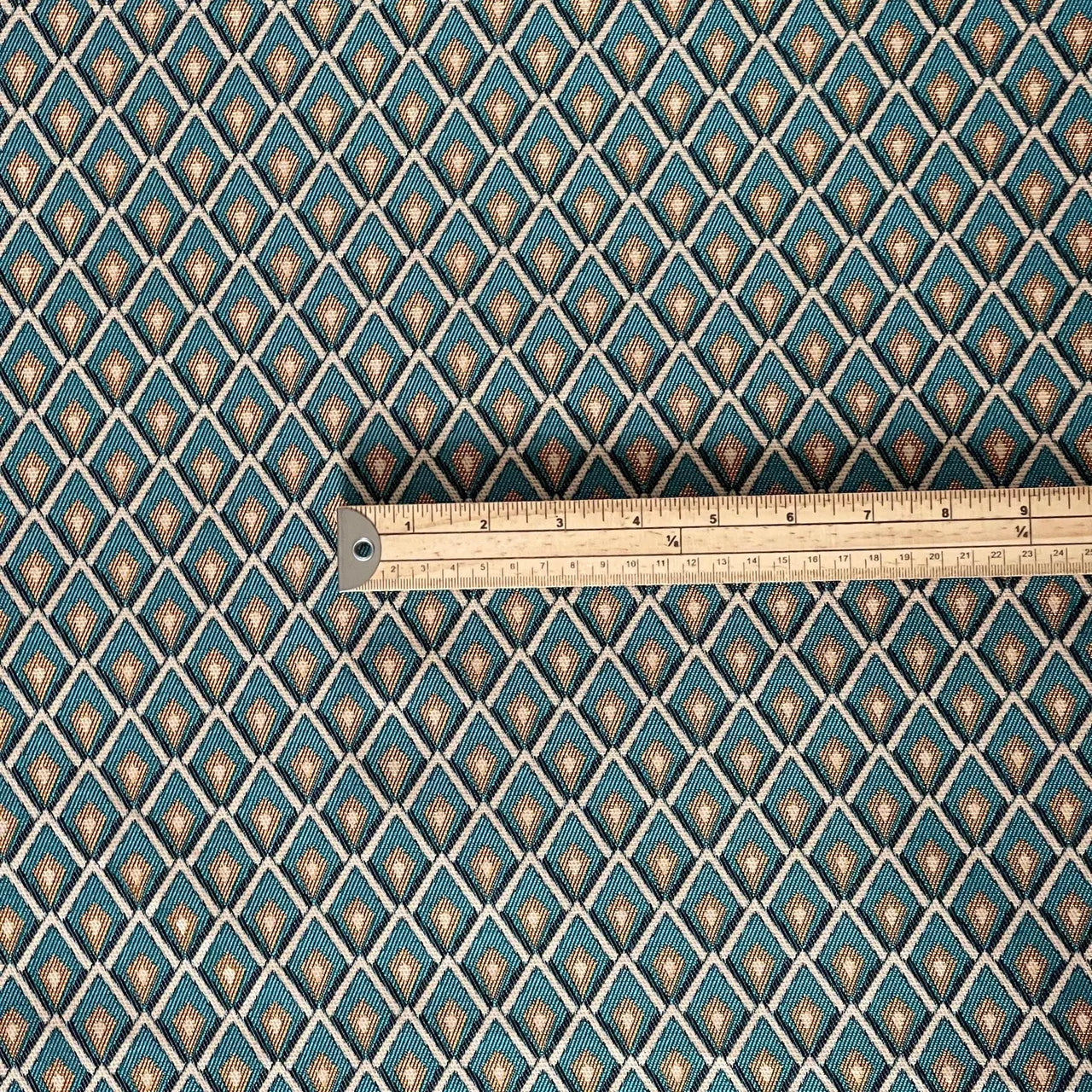 Teal lattice weave fabric shown with ruler for scale reference