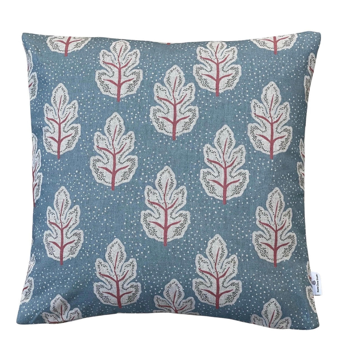 Teal leaf cushion cover with cream leaves and coral stems