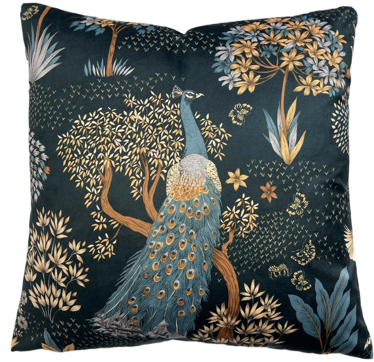 Decorative pillow with a peacock design on a dark background