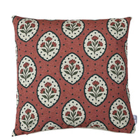 Thumbnail for Terracotta rosewood decorative cushion cover with repeating cream floral medallions, small red wildflowers, green leaves and dark dotted details on textured cotton fabric