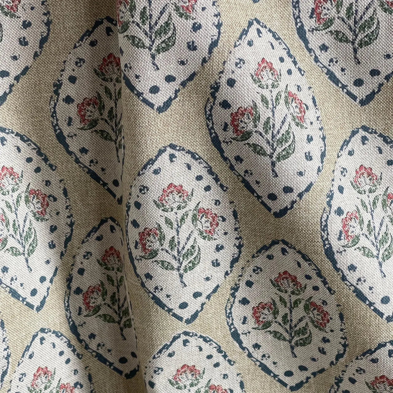 Rustic floral fabric featuring oval medallion motifs on neutral beige ground