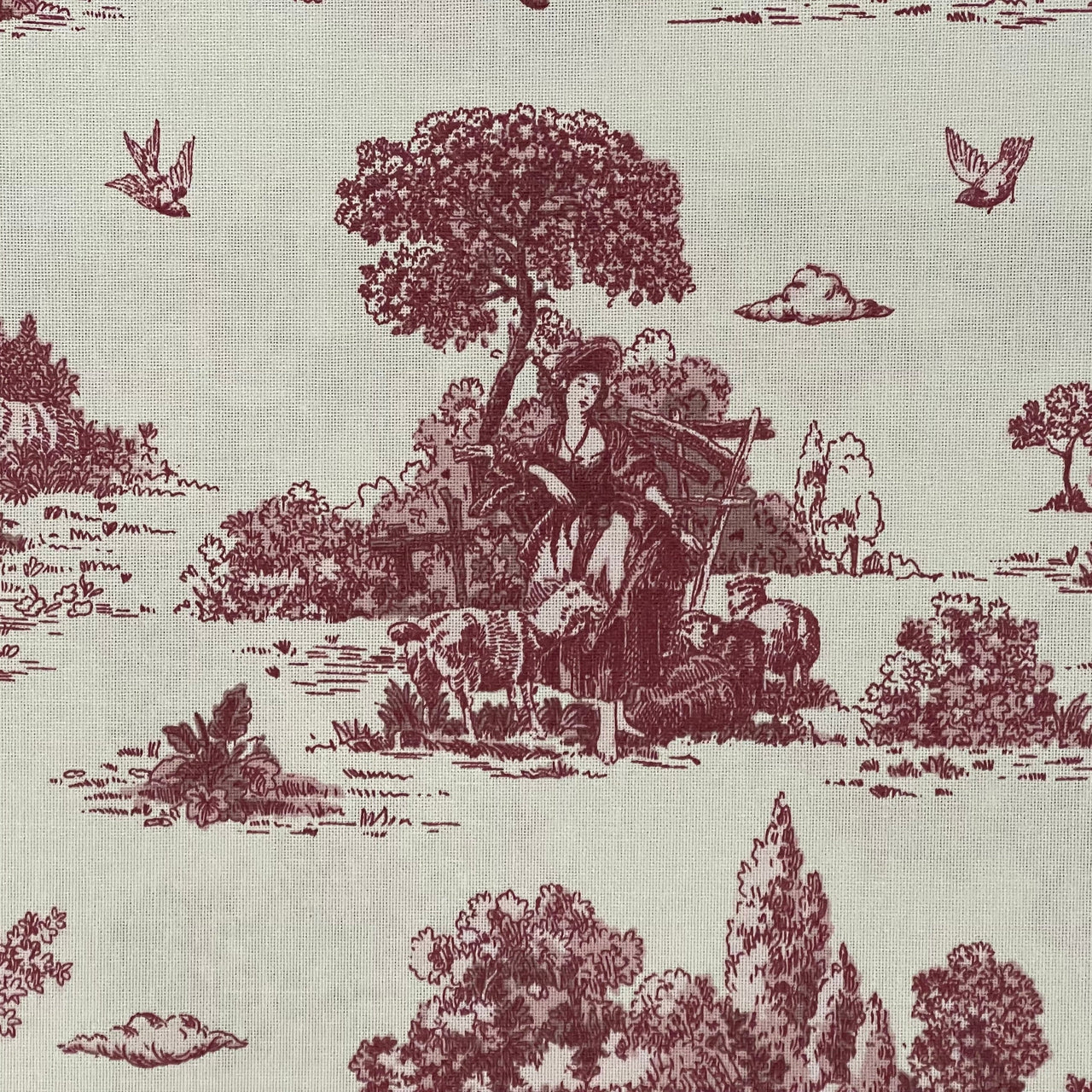 Vintage-style fabric pattern with a pastoral scene, trees, and a woman with a dog.