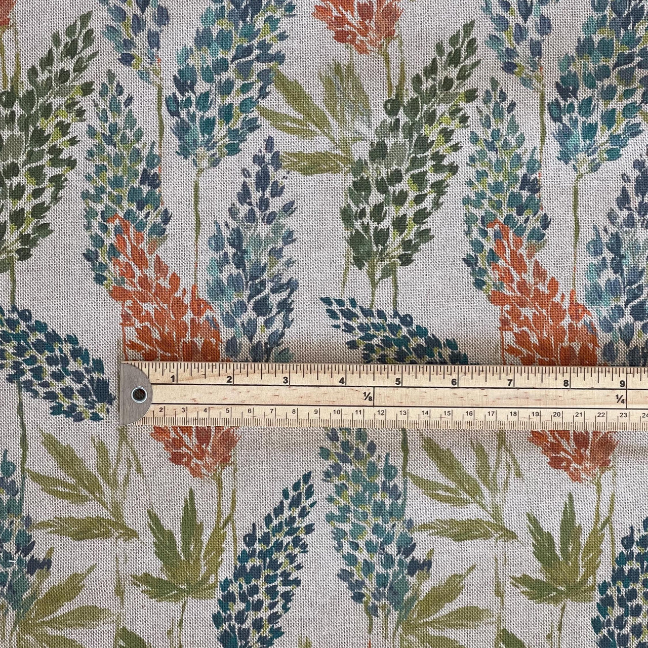 Natural cotton fabric featuring painterly meadow flowers and foliage, scale image highlighting repeat size for upholstery and drapery projects