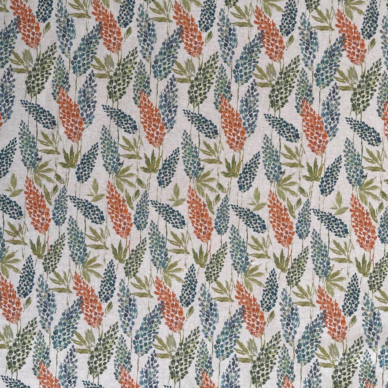 Eco-friendly wildflower print fabric in warm earthy tones, sustainable cotton material for soft furnishings and heritage-inspired interiors